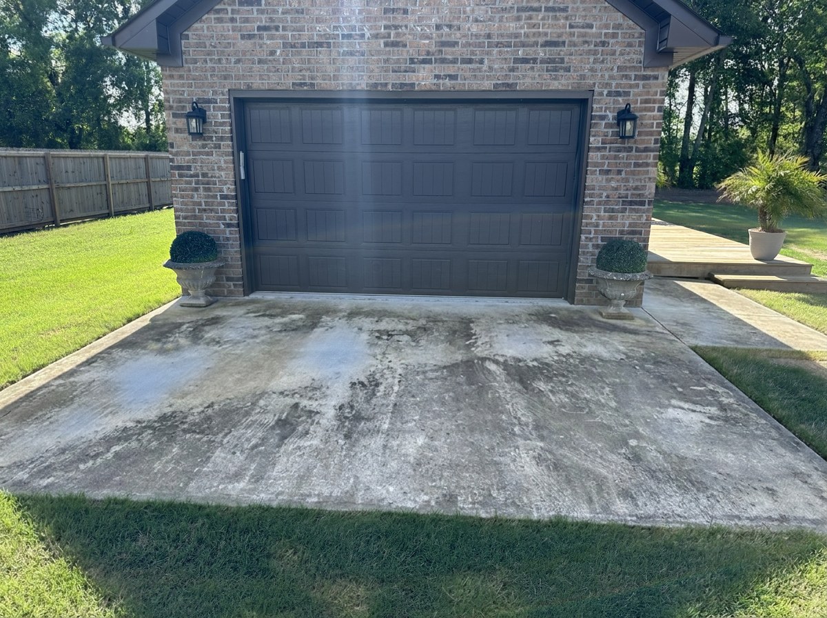 Driveway before pressure washing