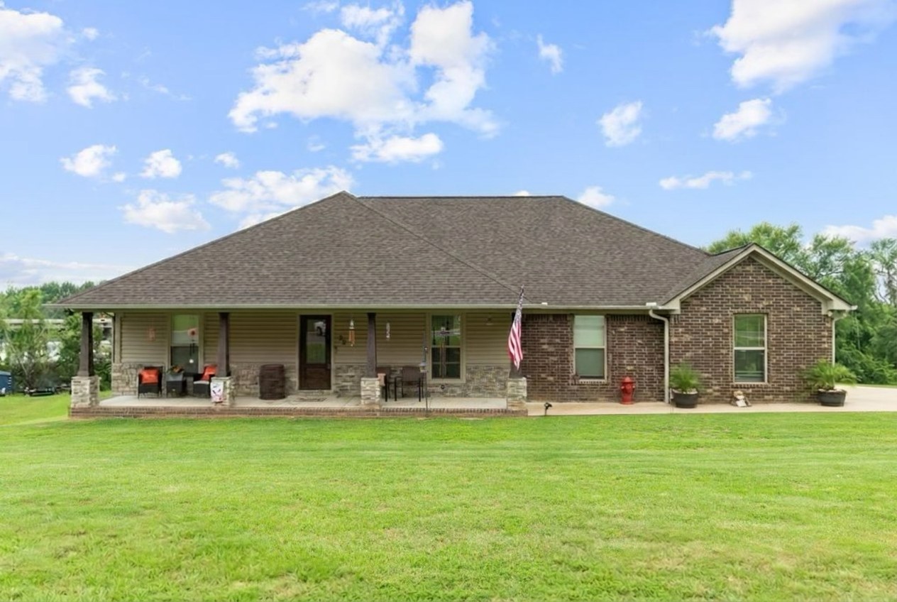 Brick home with a freshly cleaned shingle roof